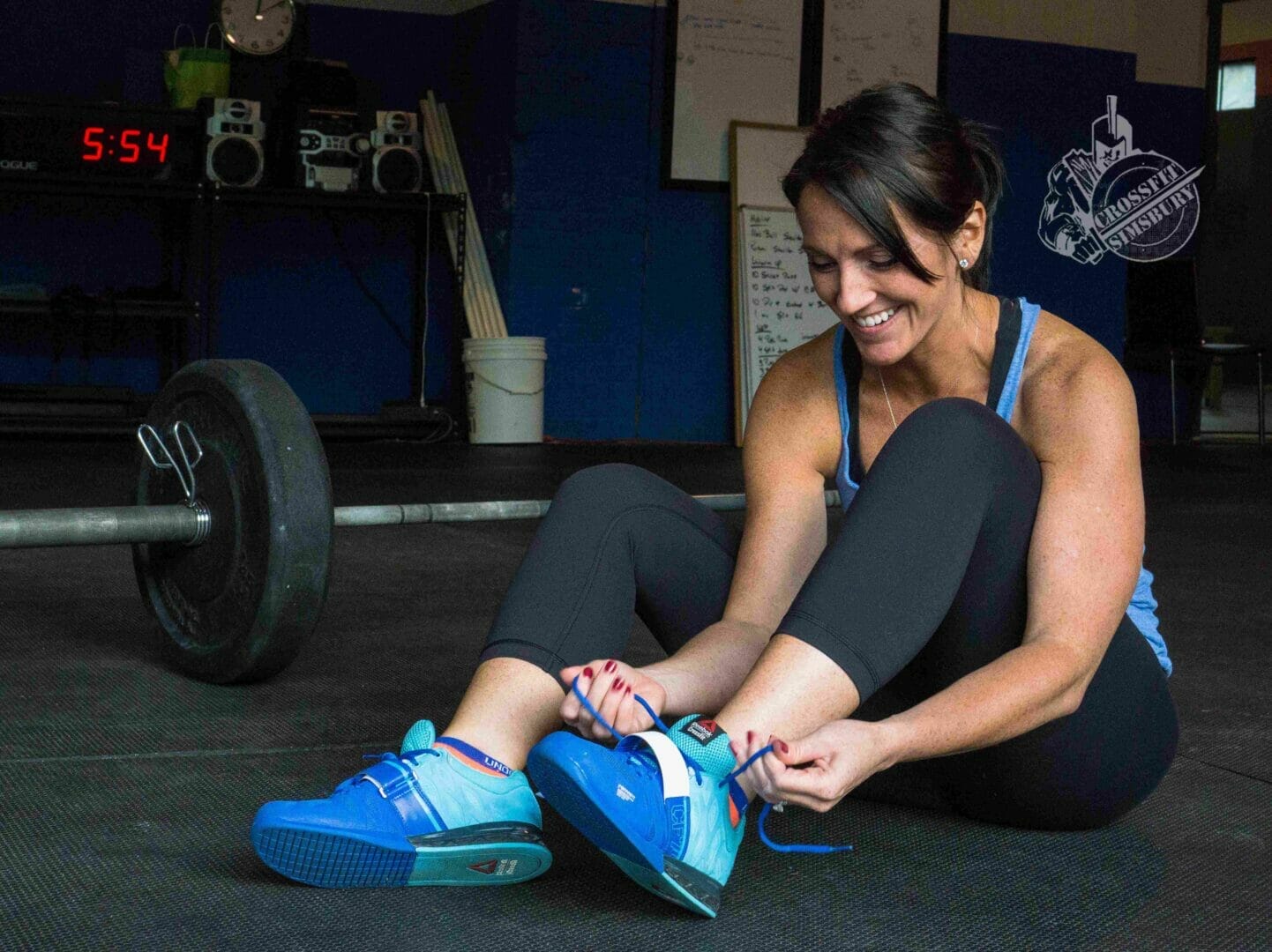 woman weightlifting shoes smile